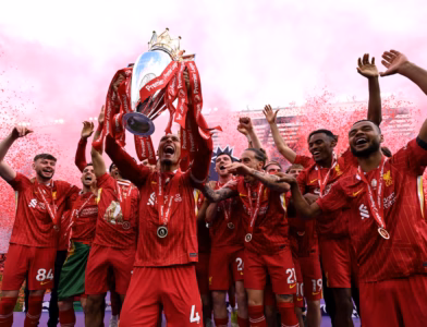 Liverpool raise the Premier League trophy as champions